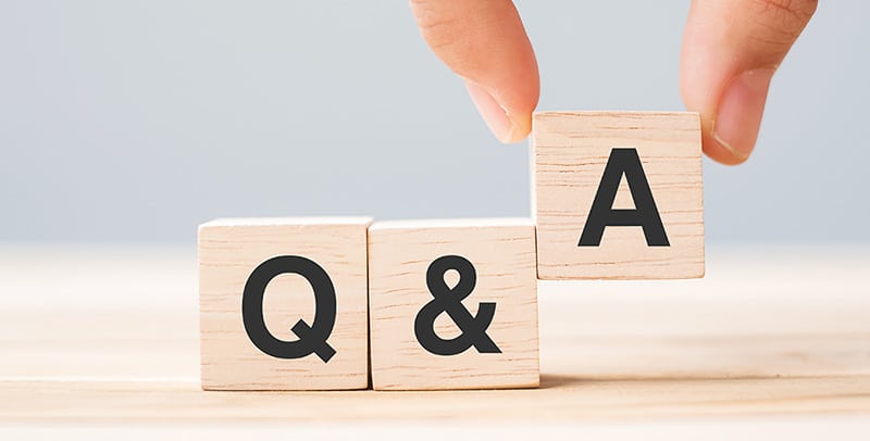 Wooden blocks arranged to spell out Q&A