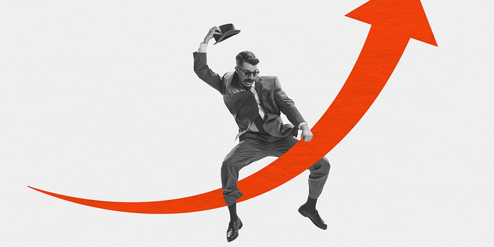 Man in suit riding a red arrow to represent what is behavioural finance concept