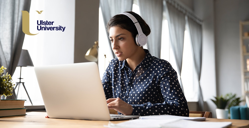 Young indian woman wearing headphones, looking for the best online fintech course